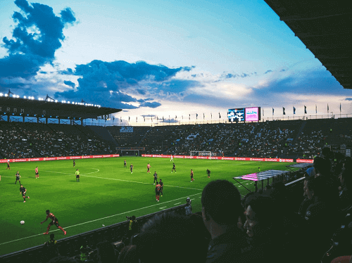 people watching a soccer match